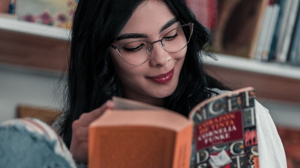 Girl in Glasses Reading a Book