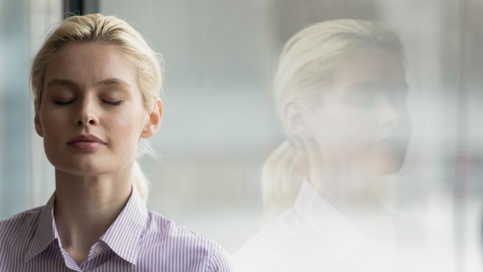 Woman Closing Eyes and Breathing