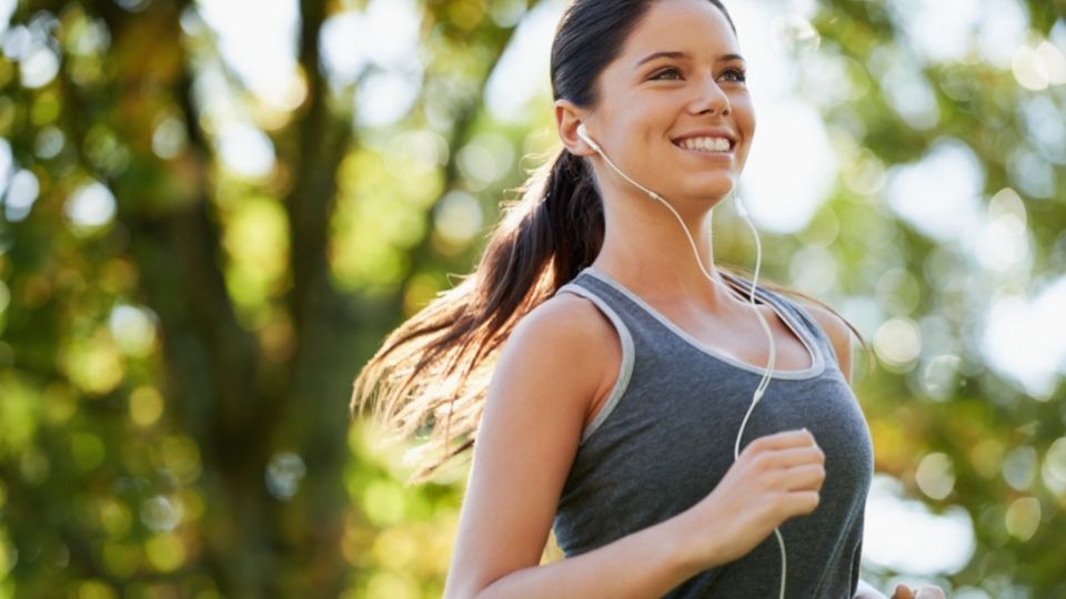Woman Jogging While Listening to Music